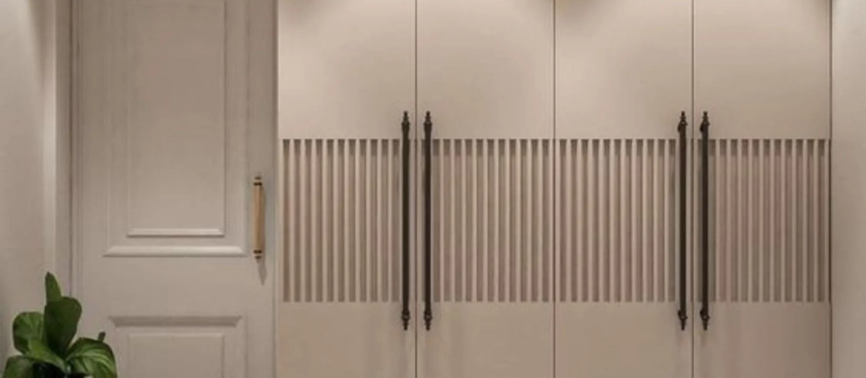 Enhance your space with this elegant wardrobe, featuring textured panels and subtle lighting.